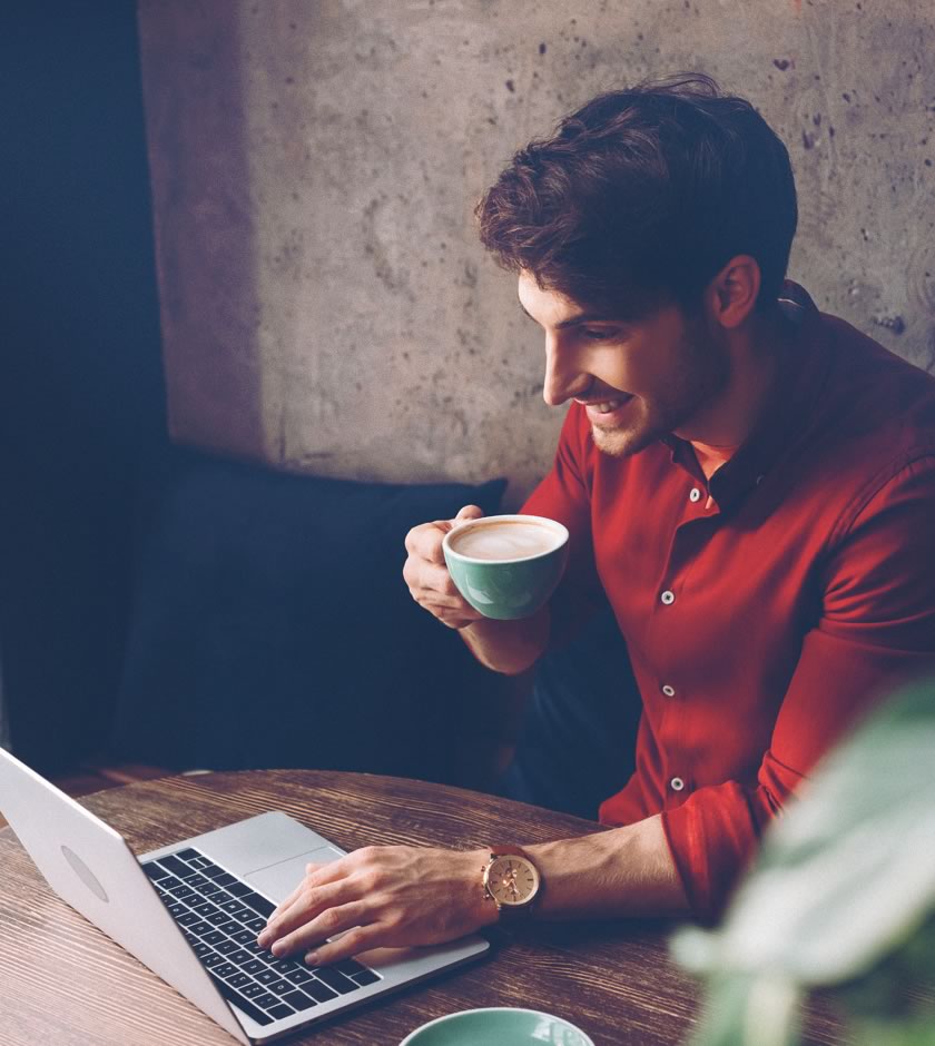 Business professional reading content from his laptop